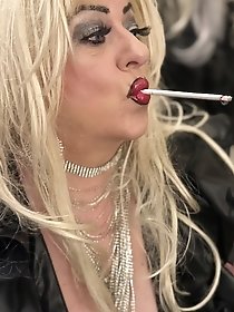 A smoking session in a new leather dress is so exciting